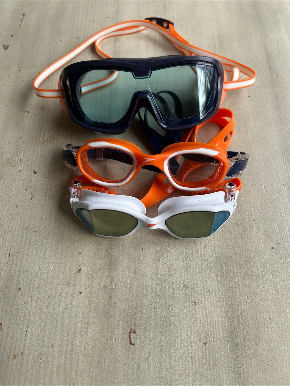 Lot of 3 Speedo Kids Swim Goggles – White, Orange & Navy colors.